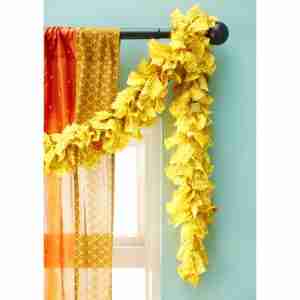 Yellow eco tinsel hung at a window